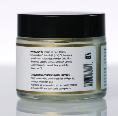 A jar of prime renders beef tallow balm a black lid and a white label showing ingredients and directions, photographed on a clean white background with a soft reflection.
