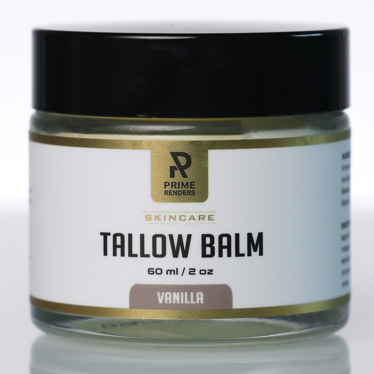A jar of Prime Renders Skincare Tallow Balm in Vanilla, featuring a white label with gold accents and a black lid, set against a clean white background with a soft reflection.