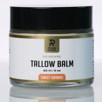 A jar of Prime Renderers Tallow Balm in Sweet Orange scent, featuring a black lid and a white label with gold and orange accents, set against a clean white background with a soft reflection below.
