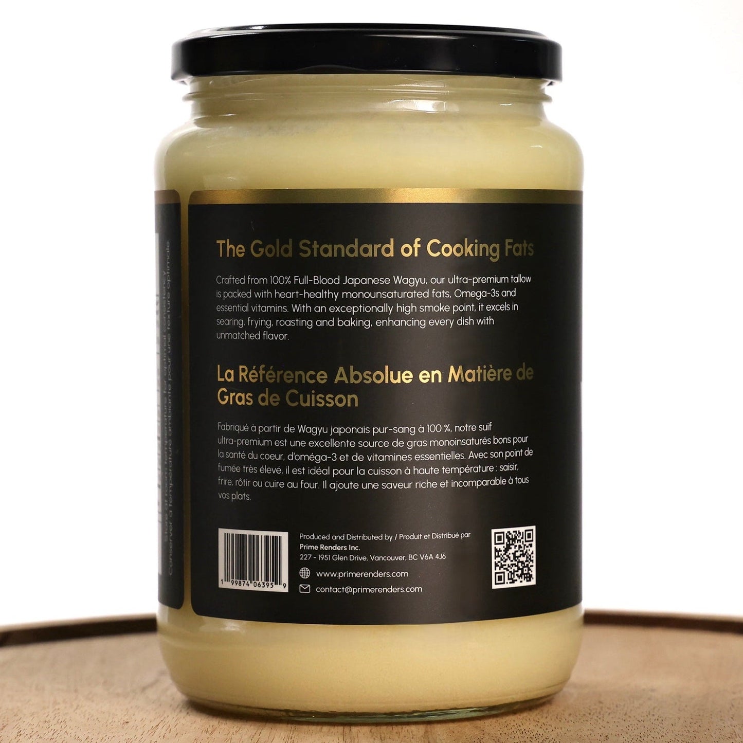 Jar of wagyu beef tallow on a wooden tray with a white background