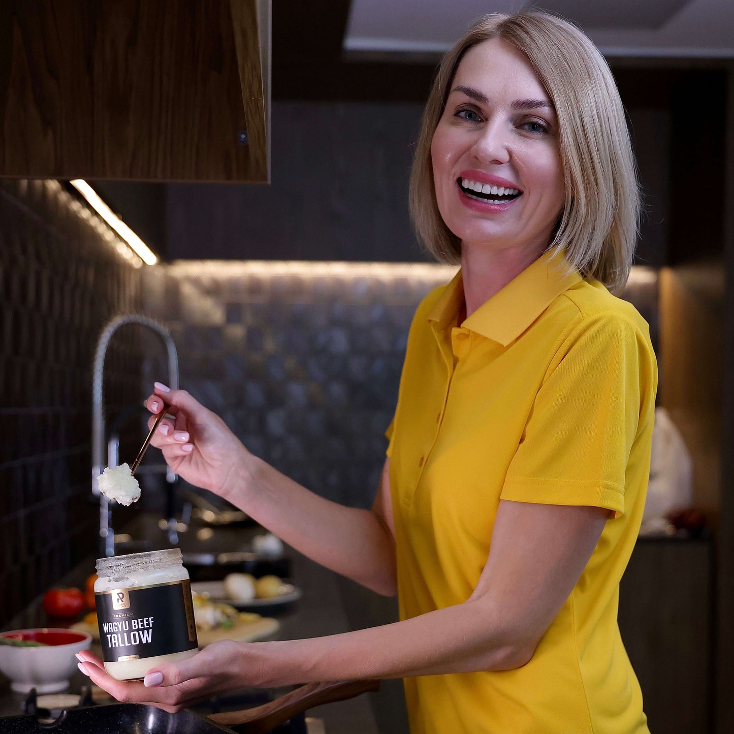 woman cooking with prime renders wagyu beef tallow cooking oil 