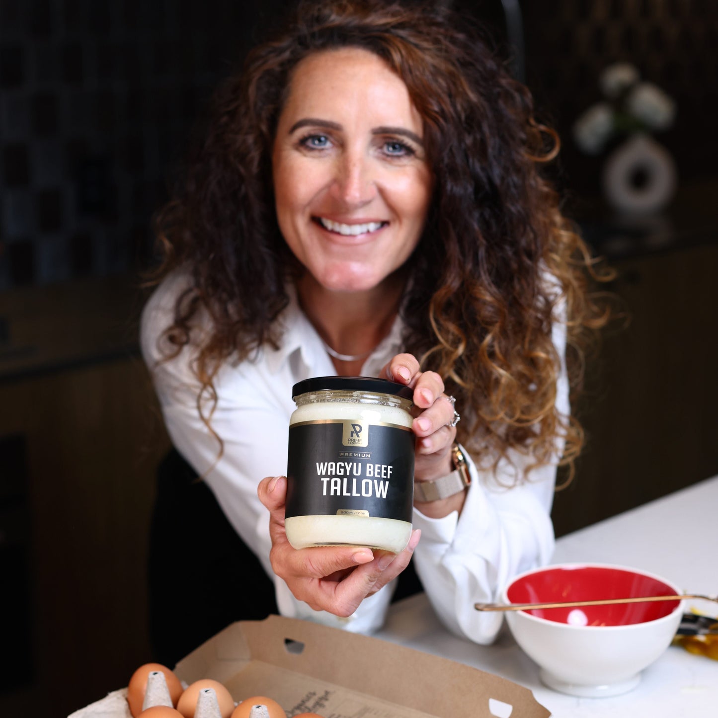 woman using prime renders wagyu beef tallow for cooking 